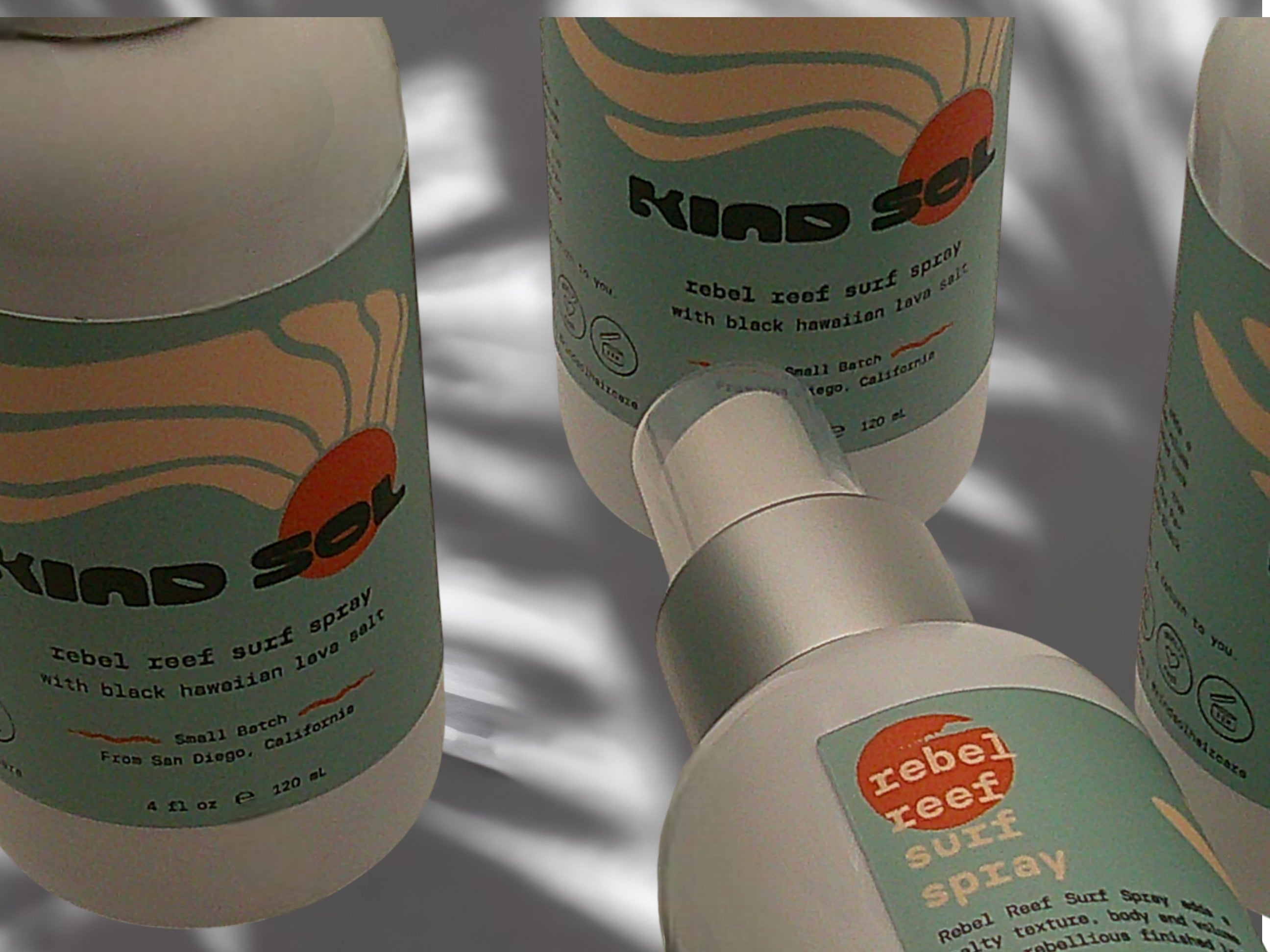 KIND SOL rebel reef surf spray bottles with lo labels on a neutral backgroundel o