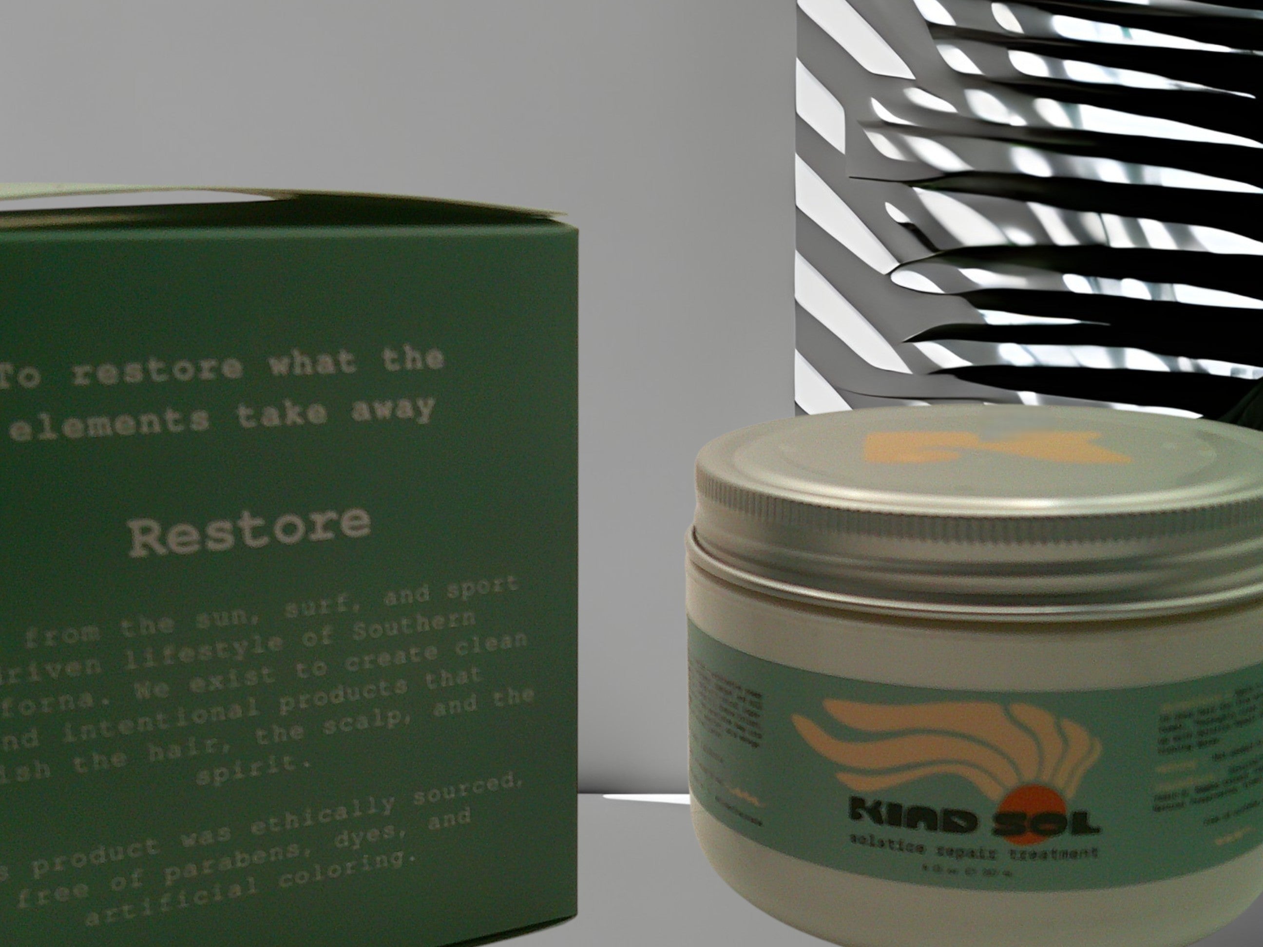 Green jar with a lid and text on a gray background